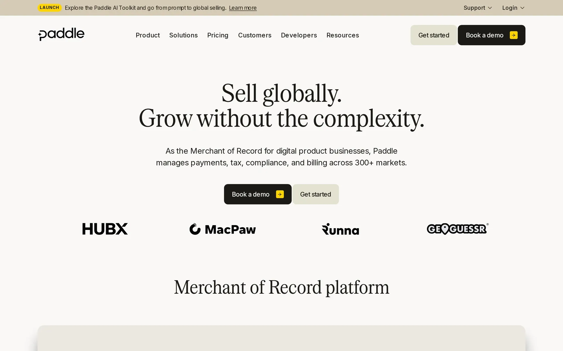 Paddle homepage: “Sell globally. Grow without the complexity.” with demo and get-started buttons and customer logos